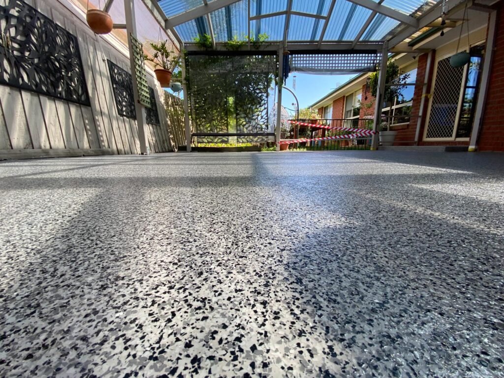 Epoxy patio installation in Melbourne with durable and stylish outdoor flooring finish