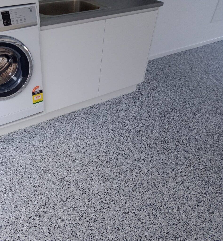 Seamless epoxy floor in a Melbourne laundry room – moisture-resistant and easy to clean with a modern finish.